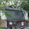 Day one removal. Materials go directly from roof to dumpster, no mess on the ground. 